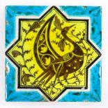 An Islamic turquoise/yellow glaze tile with peacock design, 19.5cm across