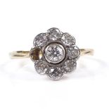 An 18ct gold diamond cluster flowerhead ring, central diamond approx 0.13ct, setting height 11.
