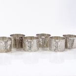 A set of 6 silver napkin rings, with applied butterfly motif, height 3cm, 7.1oz