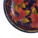 A Moorcroft pomegranate pattern fruit bowl on pewter base, stamped Tudric, pattern no. 01312,