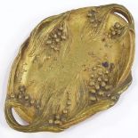 A Bouny, gilt patinated bronze 2-handled dish, with relief cast floral decoration, signed, length