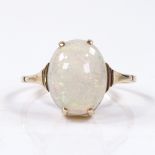 An unmarked gold cabochon opal dress ring, opal length 12mm, size L, 2g
