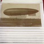 A collection of First War Period postcards, including Zeppelin and military subjects