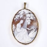 A relief carved cameo shell panel brooch, depicting Leda and the Swan, in rolled gold frame, panel