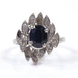 An 18ct white gold sapphire and diamond cluster cocktail ring, setting height 18.4mm, size N, 5.2g