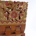A carved and gilded teak folding Koran stand, height 46cm