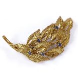 An 18ct gold sapphire leaf brooch, length 43.6mm, 8.5g