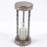 An Italian silver-mounted hour glass egg timer, with geometric terminals and beaded edge, length 8.