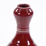 A Chinese red glaze porcelain bottle vase, height 17cm