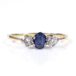 An unmarked gold 3-stone sapphire and diamond trilogy ring, sapphire length 5.23mm, size O, 1.4g