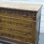 A 19th century French walnut 4-drawer commode, with carved drawer fronts and coloured marble top,