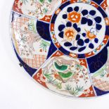 A large Chinese porcelain charger with hand painted decoration, diameter 45cm