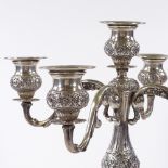 A German silver 4-branch candelabra, with relief embossed floral decoration and removable