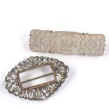A Georgian unmarked silver gold and paste buckle design brooch, together with a mother-of-pearl