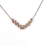 An 8ct rose gold diamond collar necklace, on box link chain, necklace length 44cm, 5.6g