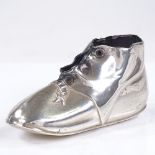 An Edwardian silver boot pin cushion, by Levi and Salaman, hallmarks Birmingham 1907, length 8.