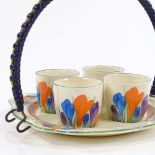 A Clarice Cliff Bizarre Crocus pattern egg set on stand