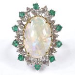 A large opal emerald and diamond cluster cocktail ring, set with large cabochon opal, marquise and