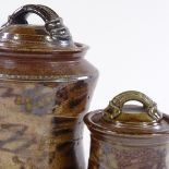Jane Hamlyn (British born 1940), 2 patterned brown salt glaze storage jars, impressed maker's marks,