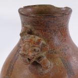 A Chang Kai pre-Colombian terracotta vase, relief moulded jaguar head-handle, and painted