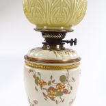 A Royal Worcester porcelain and brass-mounted oil lamp, circa 1892, hand painted and gilded floral