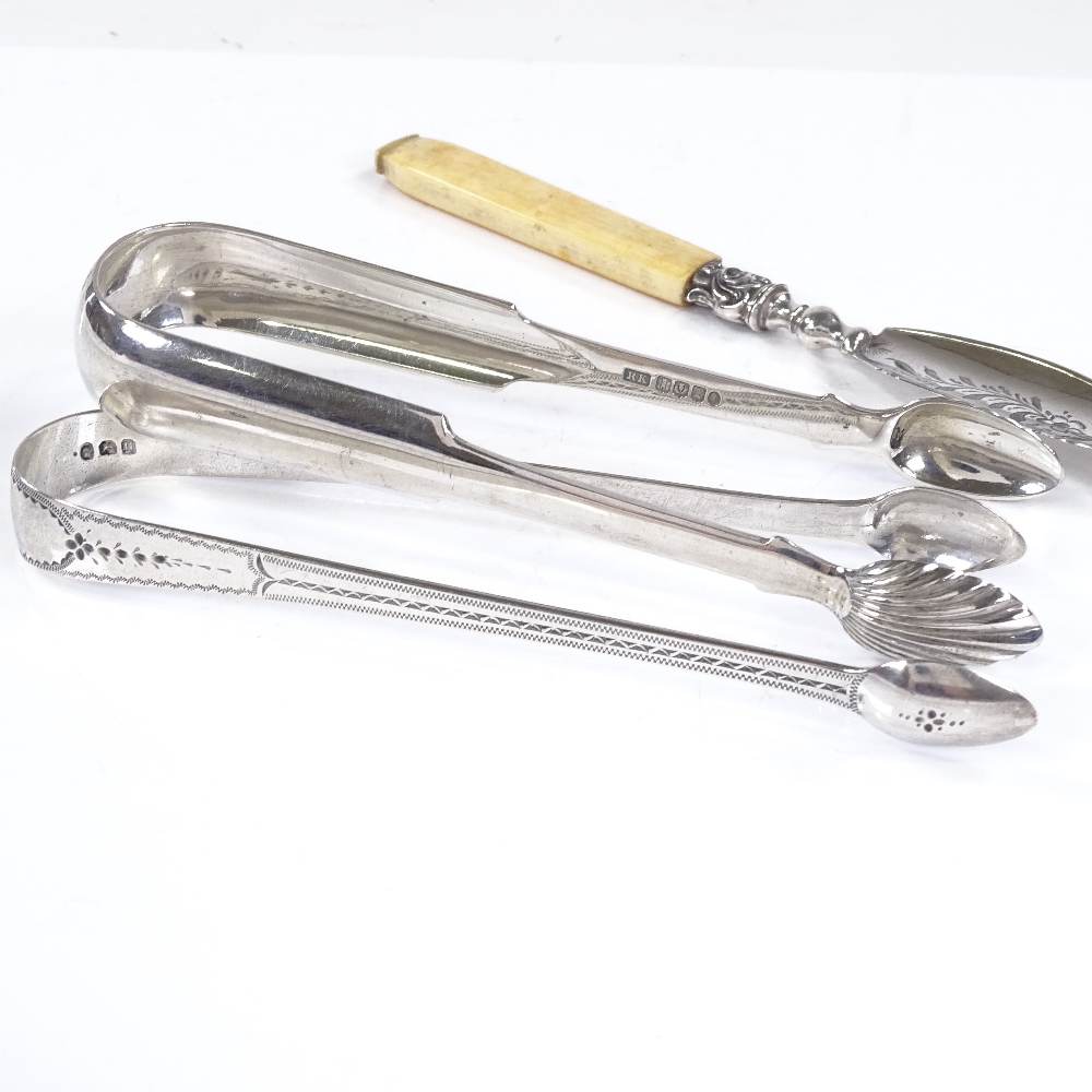 A pair of Georgian silver sugar tongs, hallmarks London 1803, a pair of Scottish silver shell-end - Image 2 of 9