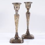 A pair of square tapered candlesticks, by Robert Pringle & Sons, hallmarks Chester 1920, height 20.