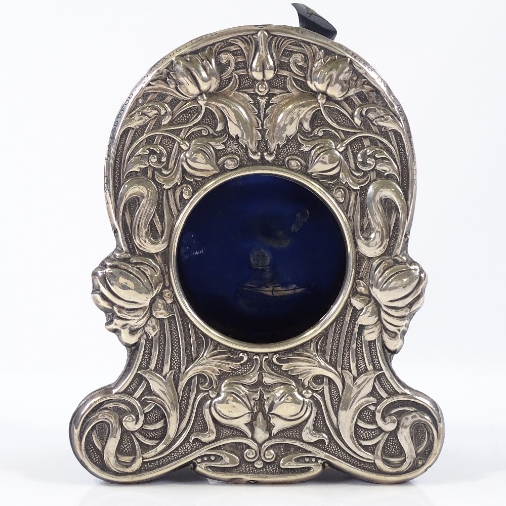 An Edwardian Art Nouveau silver-fronted watch stand, with relief embossed stylised floral decoration - Image 2 of 3