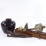A group of Oriental items, including a cast-iron reclining Buddha, a stone-set prayer wheel etc