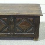 An 18th century panelled oak coffer, width 3'2"