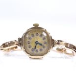 A Vintage lady's 9ct gold mechanical wristwatch, gilded dial with Deco Arabic numerals and blued