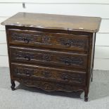 A French oak chest of 3 long drawers, circa 1900, with carved drawer fronts and shaped top, width