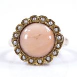 An unmarked gold coral and split-pearl cluster ring, with pierced bridge and closed back setting,