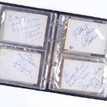 An album of autographs, including Muhammad Ali, Gene Kelly, Fred Astaire, Johnny Weissmuller,