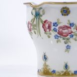 A Macintyre Moorcroft planter with trailing rose design and gilded edge, height 17cm, diameter 20cm
