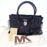 A Michael Kors black quilted leather handbag with dust bag