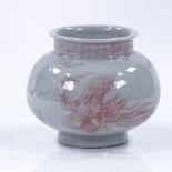 A Chinese porcelain vase with painted iron-red phoenix design, 6 character mark, height 11cm, rim