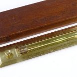 A Naval brass presentation rolling rule, with inscription and full Naval history documentation,