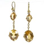 A pair of unmarked gold 2-stone citrine drop earrings, with shepherd hook fittings, height excluding