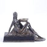 An Art Nouveau electroplate dancing girl, probably WMF, on black painted electroplate plinth, no