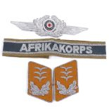 A German Luft cap cockade, a pair of Officer's collar patches, and an Afrika Korps cuff title