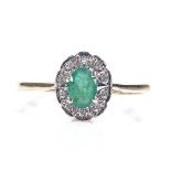 A 9ct gold emerald and diamond cluster ring, setting height 9.6mm, size R, 1.4g