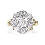 An 18ct gold diamond cluster ring, central old mine-cut diamond measures 6.85mm x 6.62mm x 4.53mm,