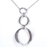 A Finnish style sterling silver 3-section pendant necklace, of graduated circular form, maker's