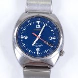 SEIKO - a stainless steel 100M automatic wristwatch, blue dial with luminous hour markers and day/