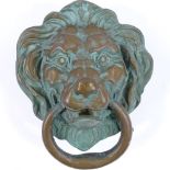 A large cast-bronze lion mask design door knocker, height 25cm