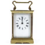 A French brass-cased carriage clock with corner columns, case height 11cm