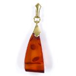 An unmarked gold mounted Baltic amber pendant, amber length 27.7mm, 2.3g