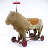 An Antique Steiff straw-filled ride-on soft toy lion, with growler, length 50cm