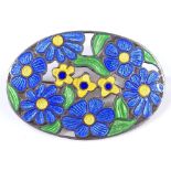 An Arts and Crafts silver and coloured enamel oval brooch, with floral decoration, maker's marks D